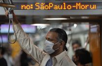 A commuter wears a protective face mask in a subway station, in Sao Paulo, Brazil, Wednesday, Dec. 1, 2021, amid the COVID-19 pandemic.