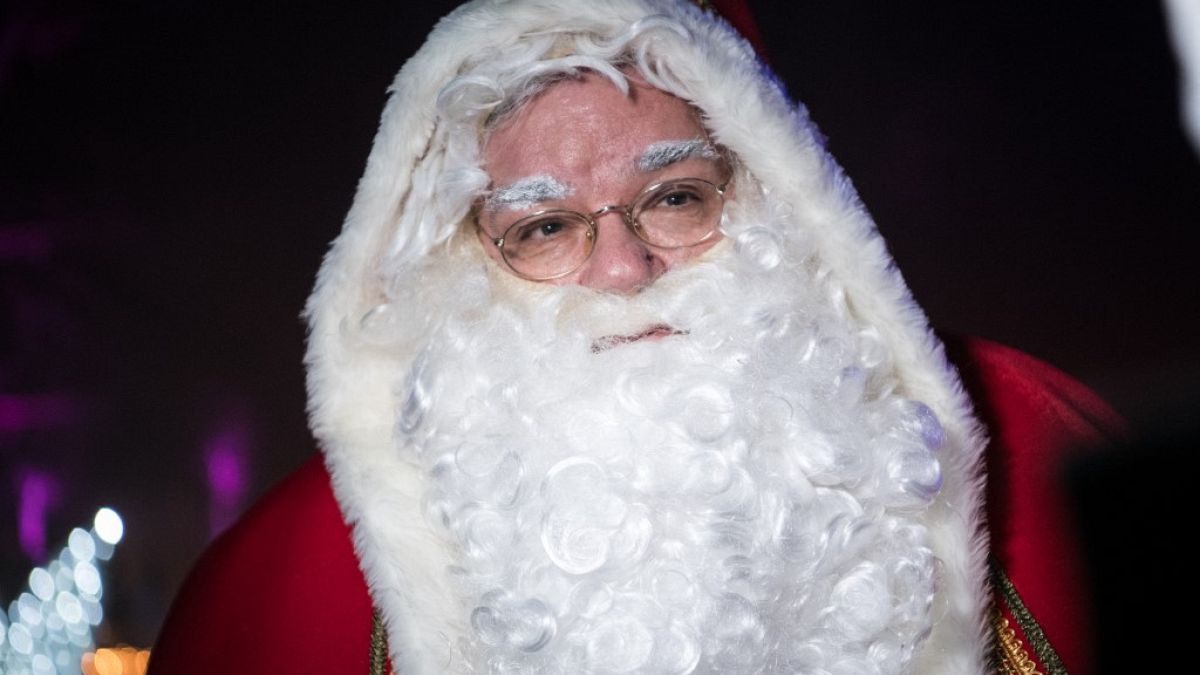 A man dressed as Santa Claus attends a Santa Claus General Assmbly at Tierpark in Berlin on November 28, 2021.