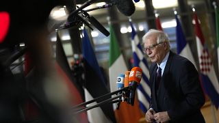 EU foreign policy chief Josep Borrell speaks with the media as he arrives for a meeting of EU foreign ministers at the European Council building in Brussels on Dec. 13, 2021.