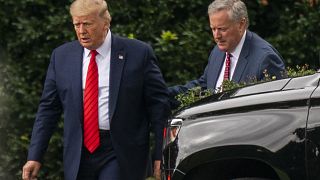 President Donald Trump talks to White House Chief of Staff Mark Meadows