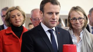 French President Emmanuel Macron, and Ile-de-France regional council president Valerie Pecresse (L), visits Les Mureaux, outside Paris, Feb. 20, 2018.