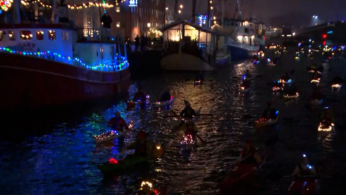 Festive kayaks in Santa Lucia procession on Copenhagen canals