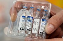 A medical worker shows vials with Russia's Sputnik V coronavirus vaccine.