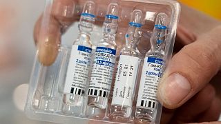 A medical worker shows vials with Russia's Sputnik V coronavirus vaccine.