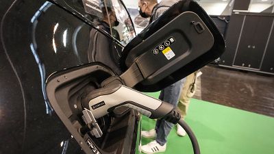 The new full electric car BMW iX is charged at the Motor Show in Essen, Germany, Thursday, Dec. 2, 2021.