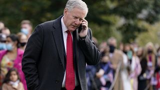 White House Chief of Staff Mark Meadows speaks on a phone on the South Lawn of the White House in Washington, on Oct. 30, 2020.