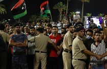 Demonstrators protest in Tripoli, Libya, on Sept. 24, 2021, in opposition to parliament passing a vote of no-confidence in the transitional government.