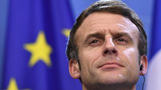 French President Emmanuel Macron addresses a media conference at the conclusion of an EU Summit in Brussels, Friday, Dec. 17, 2021.