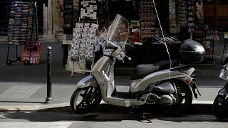 The man was observed riding a scooter and looking into shop windows.