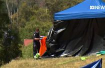 Emergency crews work at the scene after five children killed when a bouncy castle was thrown into the air due to wind.