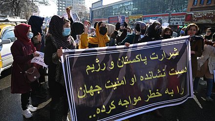 Afghan women call for rights and aid in Taliban-approved march