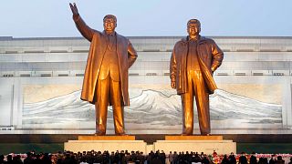 Citizens visit the bronze statues of their late leaders Kim Il Sung, left, and Kim Jong Il on Mansu Hill in Pyongyang, North Korea, Dec. 16, 2021