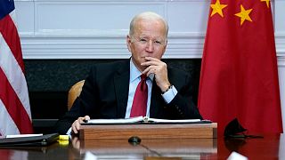 President Joe Biden listens as he meets virtually with Chinese President Xi Jinping from the Roosevelt Room of the White House in Washington, Nov. 15, 2021.