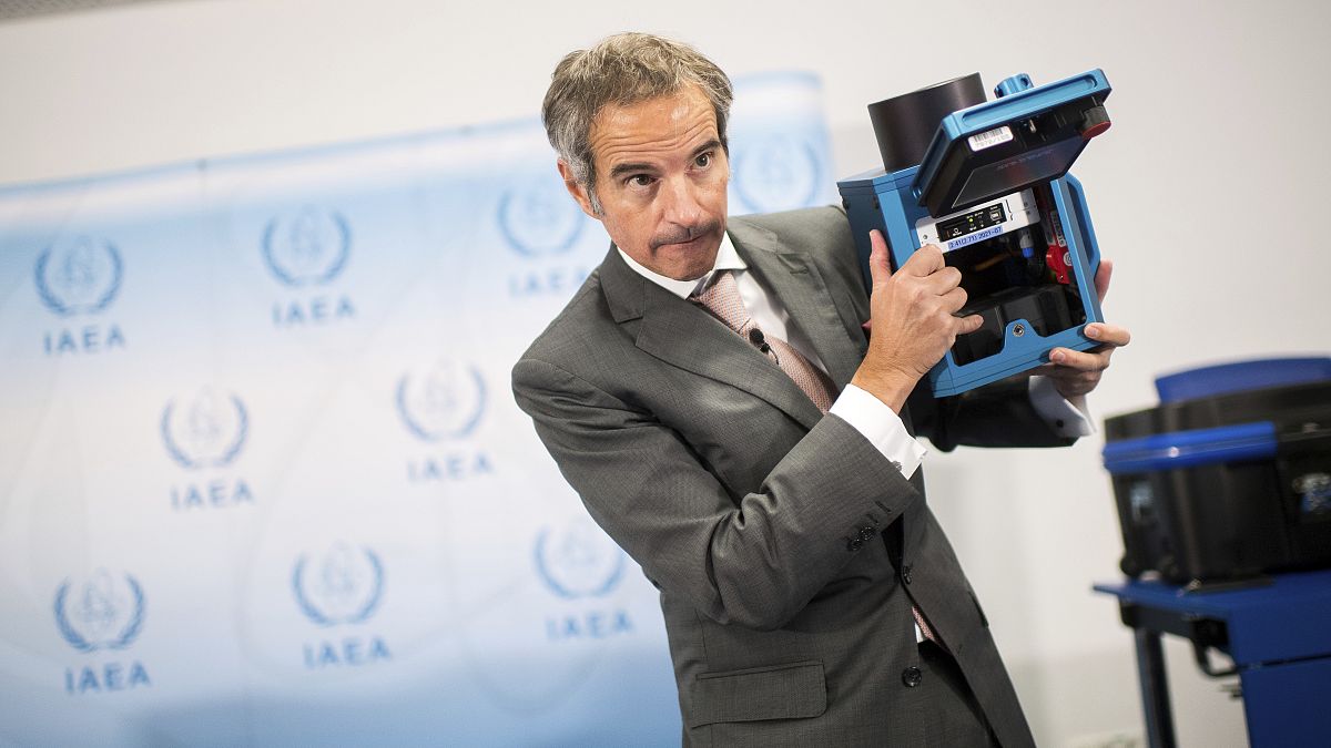 Director General of the International Atomic Energy Agency, IAEA, Rafael Mariano Grossi shows the inner of a case of an "IAEA Camera" 