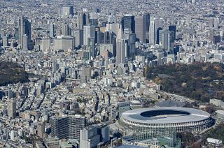 The National Stadium with skyscrapers
