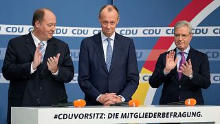 From left, candidate Helge Braun, new elected party chairman Friedrich Merz and candidate Norbert Roettgen, attend a press conference of the German Christian Democratic Party.