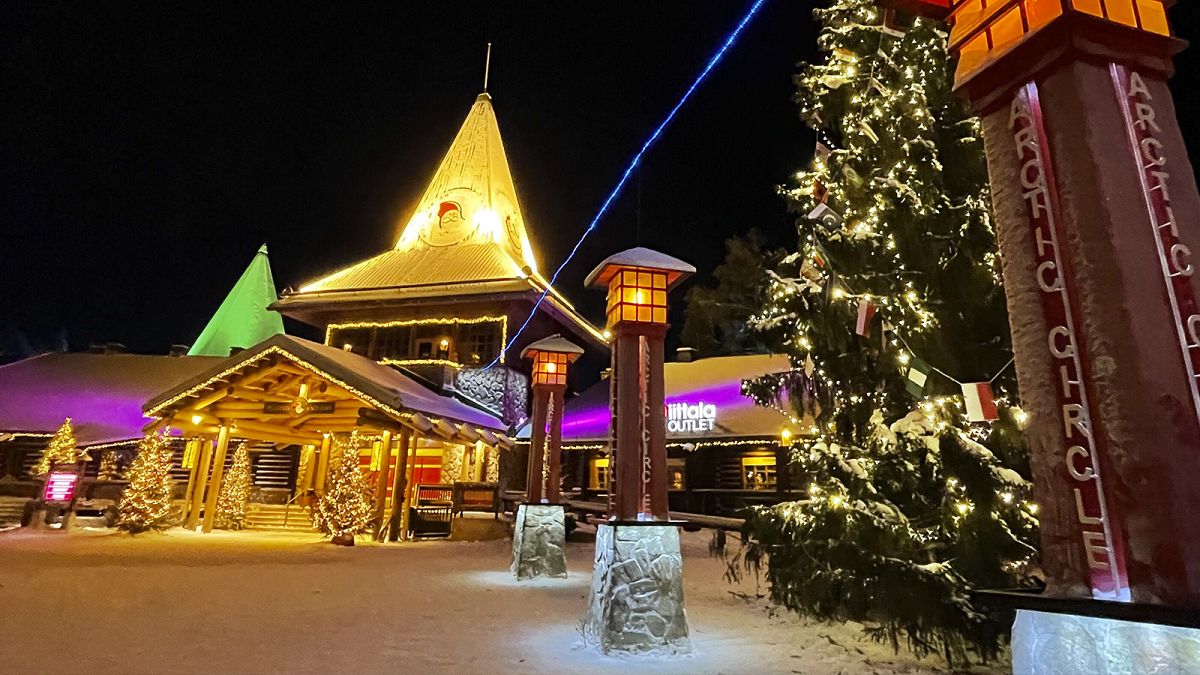 The Santa Claus Village tourist attraction lit with festive lights early in the morning in Rovaniemi, Finland