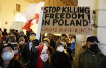 People demonstrate after the Polish parliament approved a bill that is widely viewed as an attack on media freedom, in Warsaw, Poland, Dec. 19, 2021.