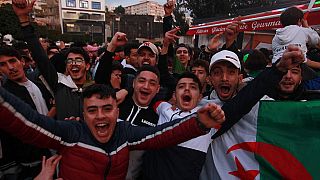 Supporters celebrate Algeria's win at Arab Cup