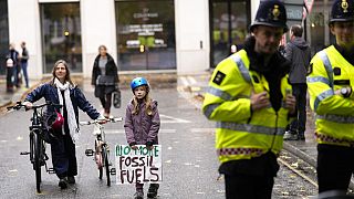 young people protesting in London ahead of the 26th U.N. Climate Change Conference (COP26).