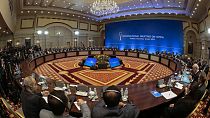 Syrian regime representatives and opposition delegates along with other attendees take part in the session of Syria peace talks in Astana on December 22, 2017.