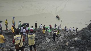 Rescuers recover bodies in Hpakant, Kachin State, Myanmar, on July 3, 2020, following a landslide at a jade mine.