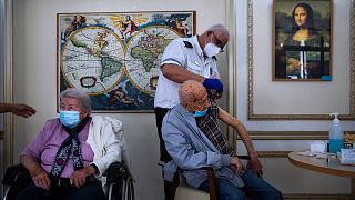 In this Jan. 13, 2021 file photo, a man receives his second Pfizer-BioNTech COVID-19 vaccine at a private nursing home, in Ramat Gan, Israel.