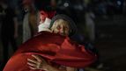 Santa Claus climbs down building to visit children in a Spanish hospital