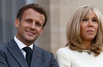 French President Emmanuel Macron and his wife Brigitte Macron at the start of France's annual 'fete de la musique' at Elysee Palace in Paris, June 21, 2021.