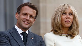 French President Emmanuel Macron and his wife Brigitte Macron at the start of France's annual 'fete de la musique' at Elysee Palace in Paris, June 21, 2021.