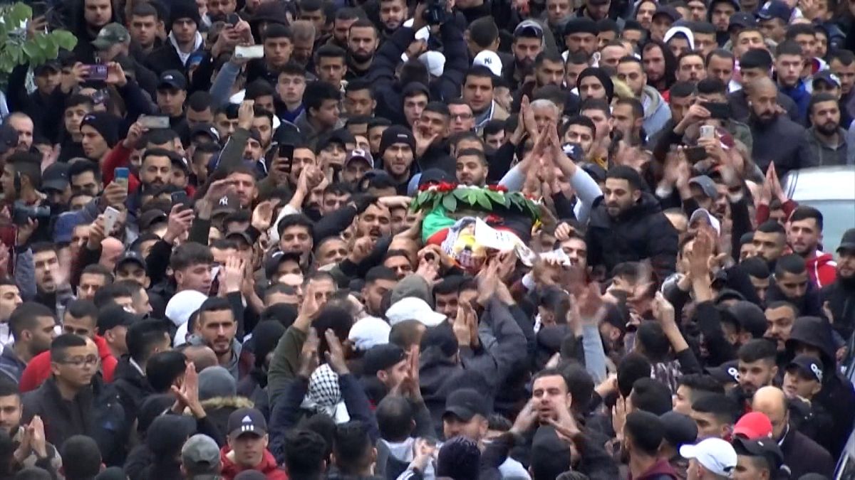 Mourners carrying the body of Palestinian Mohammed Issa Abbas during his funeral at the al-Amari refugee camp in Ramallah