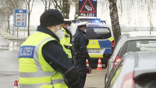 Federal police officers stop cars coming from the Netherlands for an inspectional near the border at the Horbach district in Aachen, Germany, April 6, 2021. 