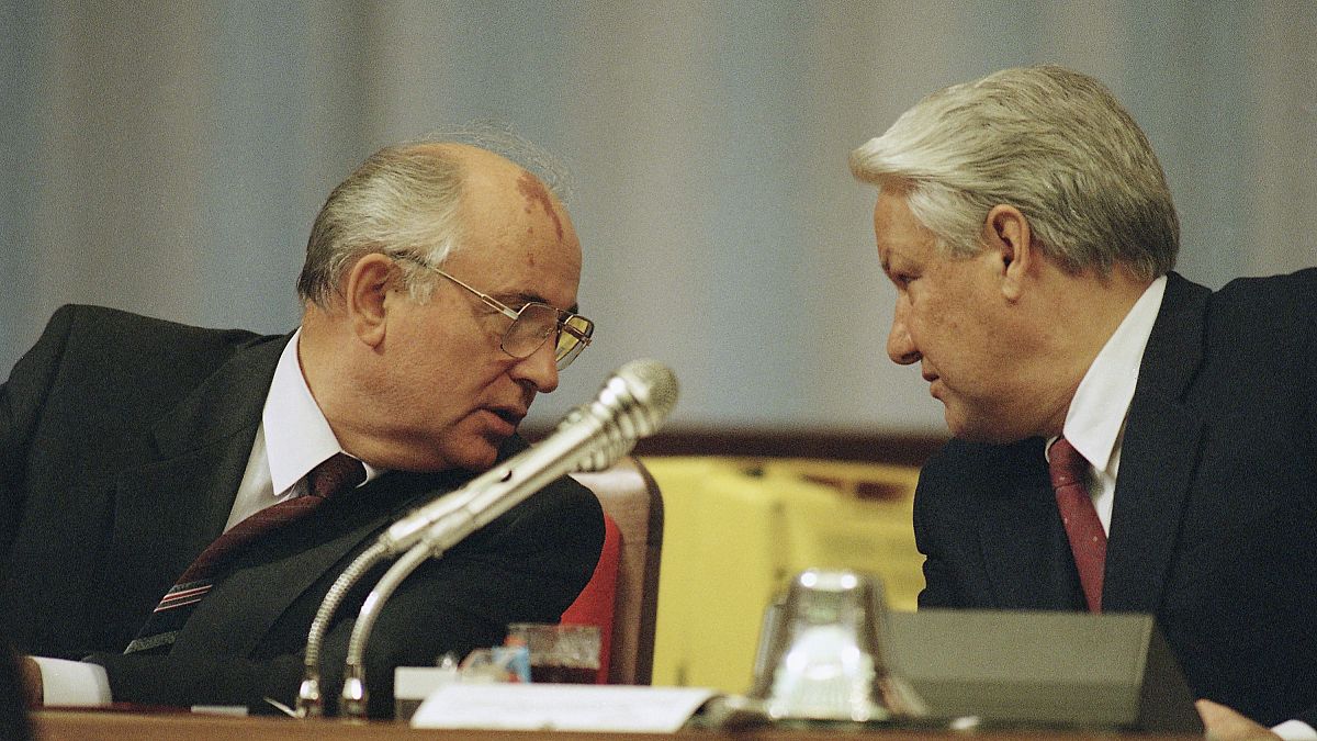 Soviet President Mikhail Gorbachev, left, and Russian Federation President Boris Yeltsin confer during a meeting of the Congress of People's Deputies on Monday, Sept. 2, 1991