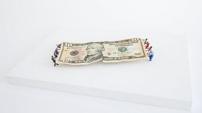 A $10 dollar bill version of the Tug of War.