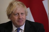 British Prime Minister Boris Johnson watches journalists as he welcomes the Sultan of Oman, Haitham Bin Tarik Al Said, to 10 Downing Street in London, Dec. 16, 2021.
