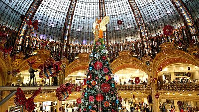 A Christmas tree lights up the centre of the Galeries Lafayette department store in Paris.