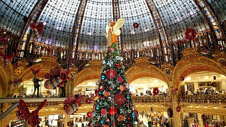 A Christmas tree lights up the centre of the Galeries Lafayette department store in Paris.