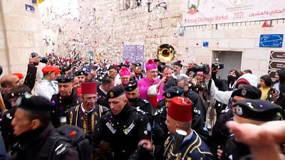 Palestinians meeting Latin Patriarch of Jerusalem Pierbattista Pizzaballa as he walks through Bethlehem