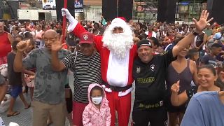 Christmas: 'First ever' Black Santa delights kids at Rio favela