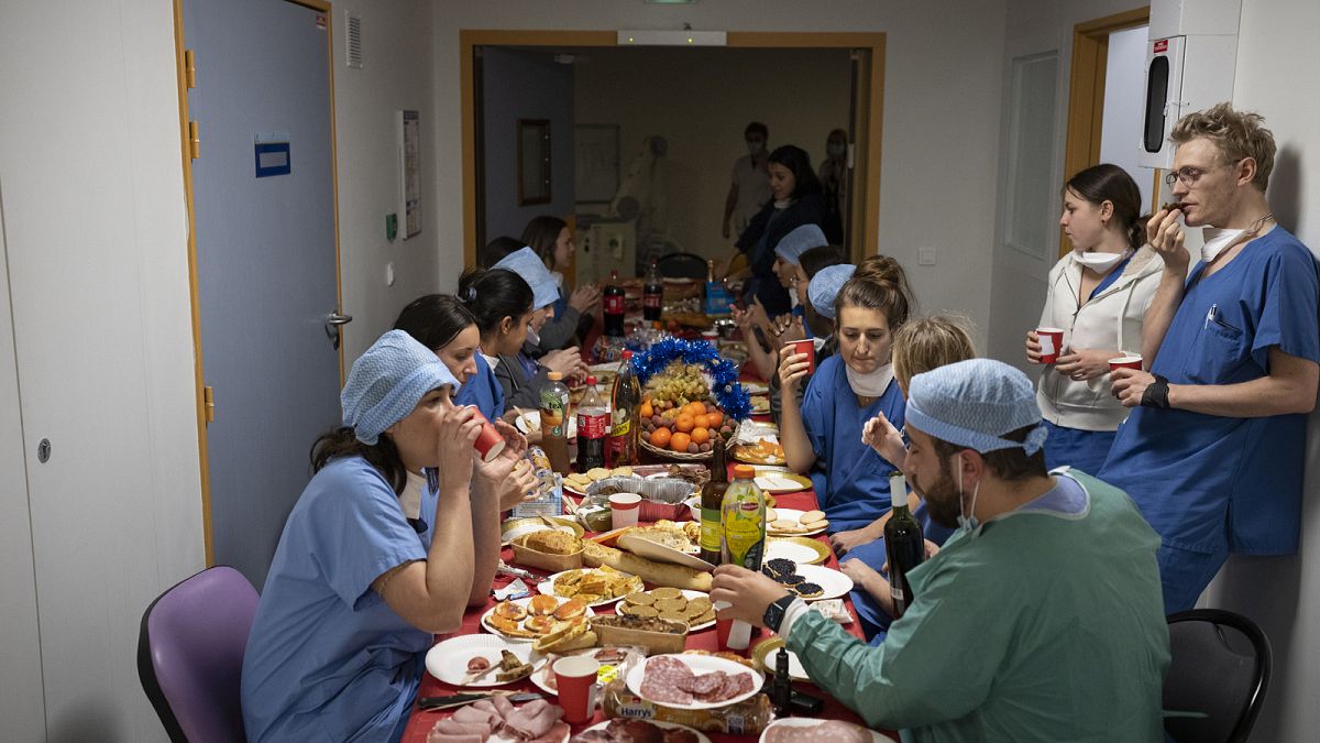 Doctors and nurses share a Christmas Eve meal together in the COVID-19 intensive care unit at la Timone hospital in Marseille