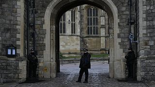 Police guard the Henry VIII gate at Windsor Castle at Windsor, England on Christmas Day