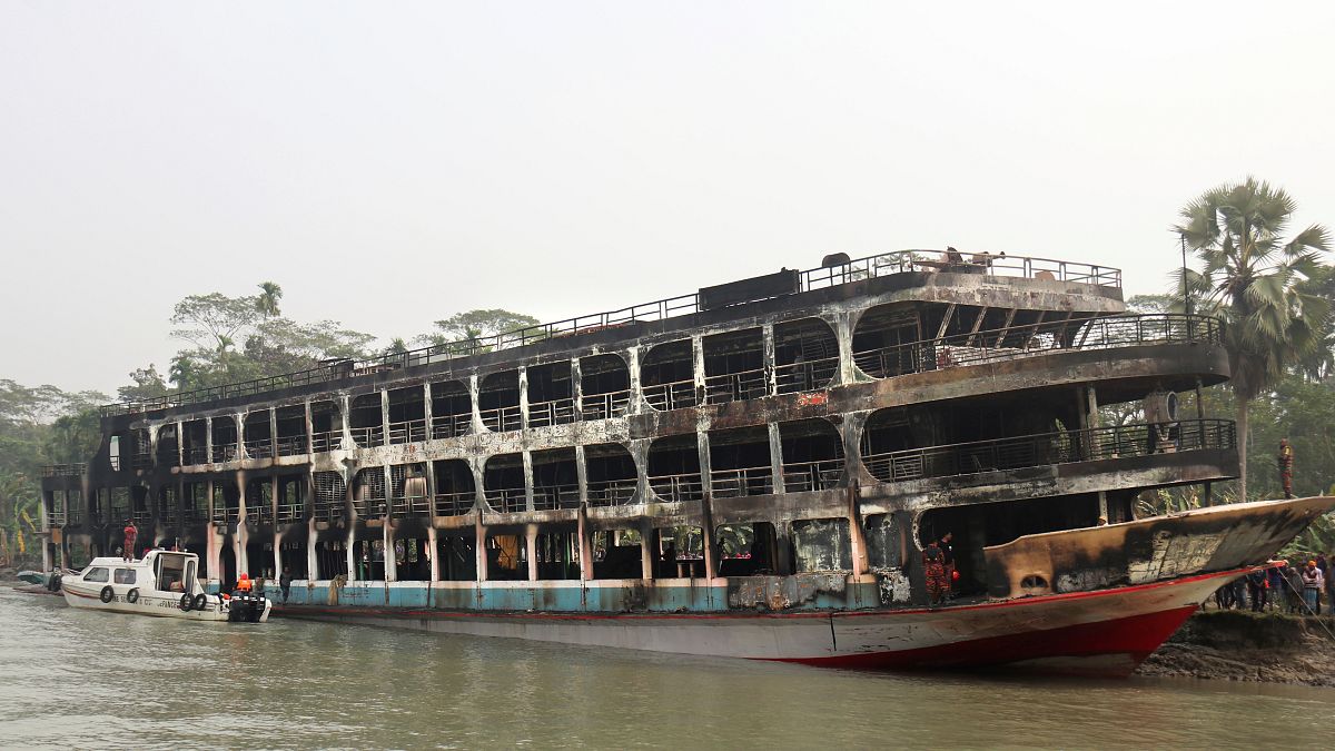 The burnt passenger ferry anchored off the coast of Jhalokati district on the Sugandha River in Bangladesh