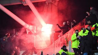 Flares were thrown and fighting broke out during the match between Paris FC and Lyon