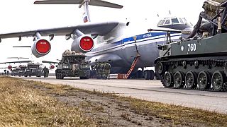 Russian military vehicles prepare to be loaded into a plane for airborne drills during maneuvers in Crimea on April 22, 2021