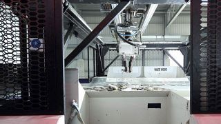 Image shows an AI-powered zenrobotics recycling robot at work.