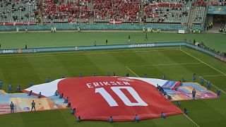 Denmark fans and players show their support for Christian Eriksen following his cardiac arrest at Euro 2020