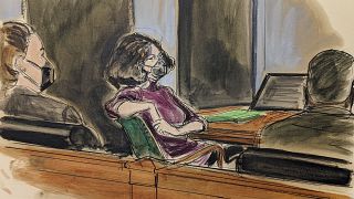 In this courtroom sketch, Ghislaine Maxwell, center, sits in the courtroom during a discussion about a note from the jury, during her sex trafficking trial, Wednesday, Dec. 29