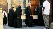 Clerics carry the coffin of Anglican Archbishop Emeritus Desmond Tutu at the St. George's Cathedral where he will lie in state for two days in Cape Town, South Africa.