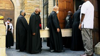 Clerics carry the coffin of Anglican Archbishop Emeritus Desmond Tutu at the St. George's Cathedral where he will lie in state for two days in Cape Town, South Africa.