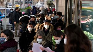 People line up at a rapid swab testing site in Rome, Thursday, Dec. 30, 2021. 